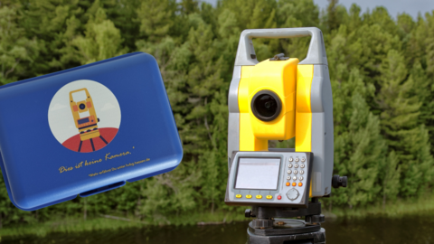 Messinstrumente Blaue Brotdose neben einem Tachymeter